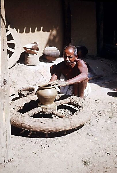 Muria tribal (Gonds) forming clay pot at Narainpur Bastar District MP India