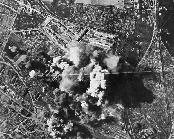 Murky smoke spouts up from the Bettenhausen Focke Wulf plant at Kassel as bombs register