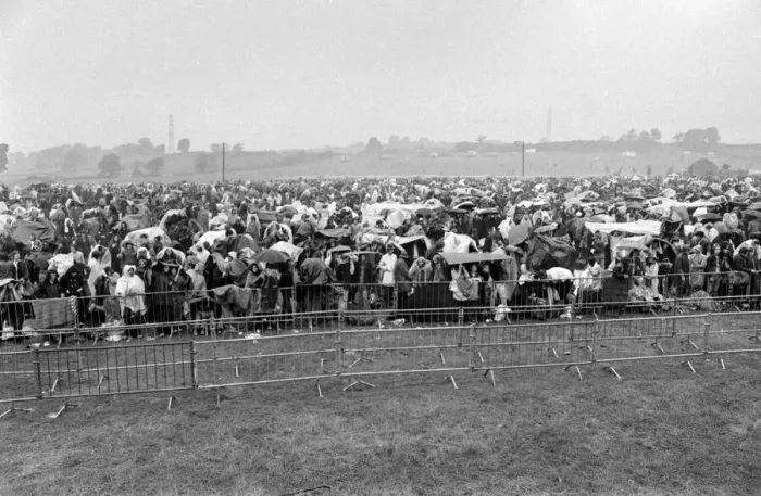 Framed Print : Music Fans in the rain at the Bath Festival of Blues & Progressive Music