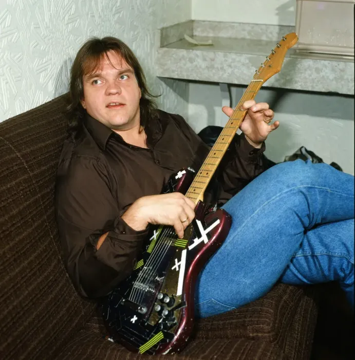 Framed Print : Musician Meat Loaf playing his guitar. September 1983