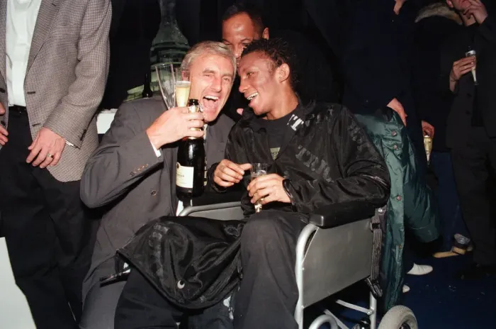 Framed Print : Musician Tricky, in a wheelchair pictured with another guest at the Brit Music Awards Framed Print : Musician Tricky, in a wheelchair pictured with another guest at the Brit Music Awards
