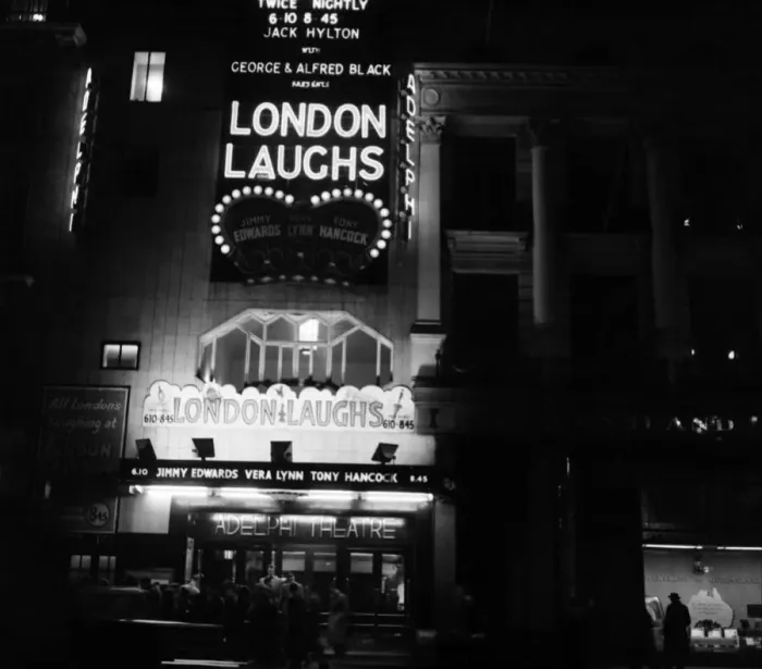 Framed Print : Names of stage shows in lights at London Theatres (night shots). London Laughs