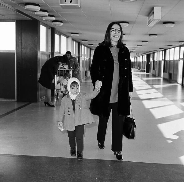 Nana Mouskouri arrives at Heathrow Airport from paris, with her son Nicky, aged 2