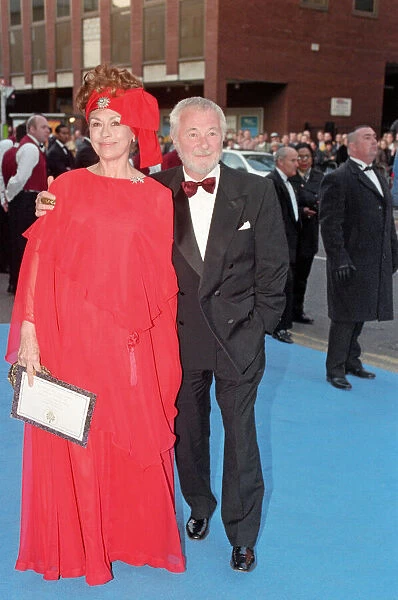 Nanette Newman and Bryan Forbes arriving at Elton John