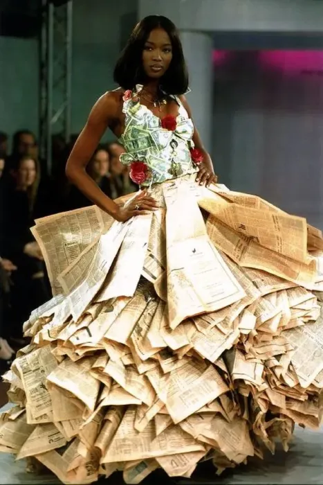  : Naomi Campbell wearing a newspaper and money dress at the Clothing Brition Fashion Show