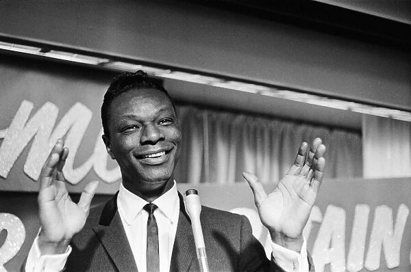 Nat King Cole, American singer, and pianist performing in London