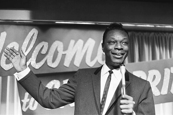 Nat King Cole, American singer, and pianist performing in London