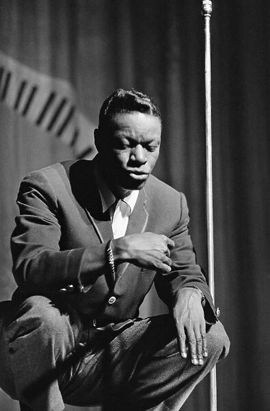 Nat King Cole sings at The Royal Variety Show held in the presence of her Her Majesty