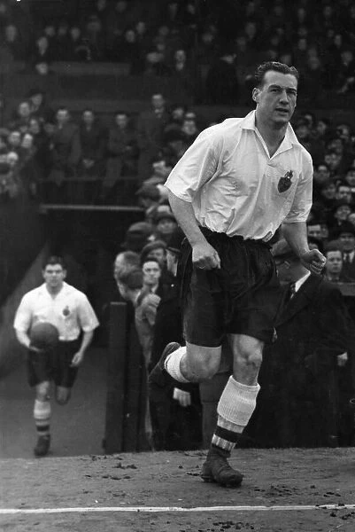 Nat Lofthouse of Bolton Wanderers and England running on to the pitch Circa 1955