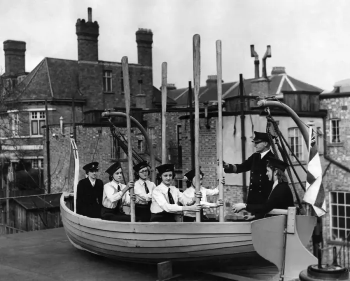 Framed Print : Naval training corp girls learning how to row a boat during the war Framed Print : Naval training corp girls learning how to row a boat during the war