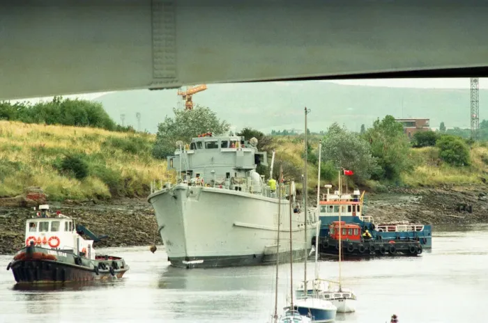 Framed Print : Former Navy Minehunter HMS Kellington being towed underneath the Princess of Wales Bridge