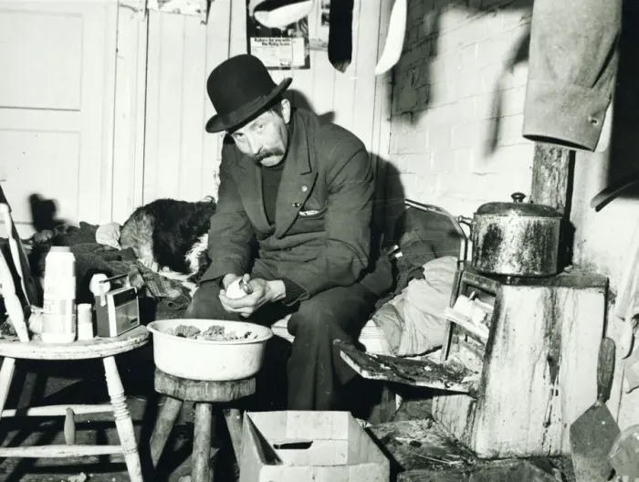 Framed Print : Ned Webb peeling a potato in his small room adjoining a disused stable on a deserted farm Framed Print : Ned Webb peeling a potato in his small room adjoining a disused stable on a deserted farm