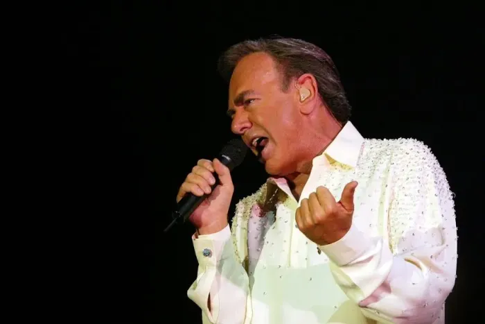 Framed Print : Neil Diamond entertains the crowd at the Telewest Arena last night