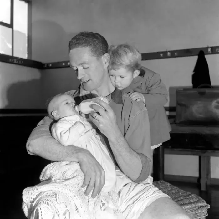 Framed Print : Neil Dougall (Plymouth Argyle) feeds his children in football dressing room