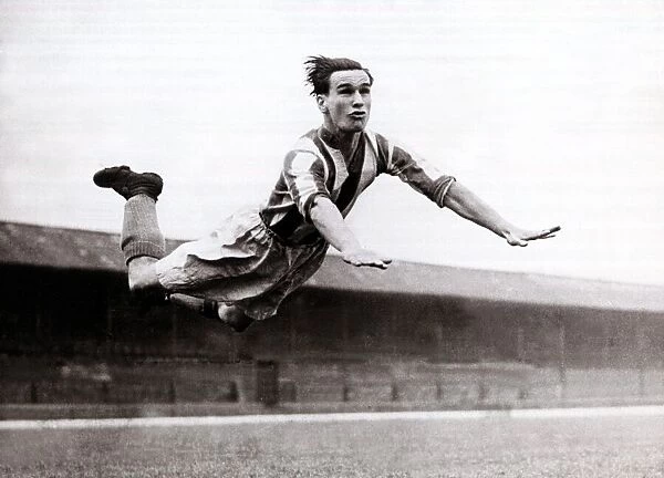 Neil Franklin, Stoke City football player, circa 1947 In mid flight at