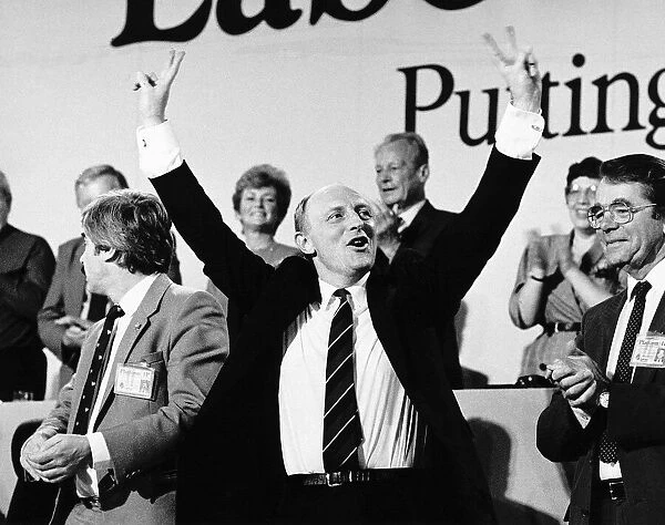 Neil Kinnock Labour Leader politician salutes the cheering delegates at Labours party