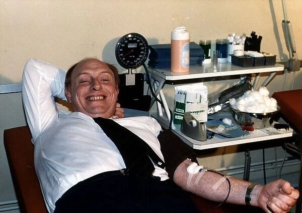 Neil Kinnock MP giving blood