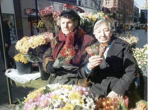 Nellie Halsted (left) the oldest flower girl in the country seen here at her Market