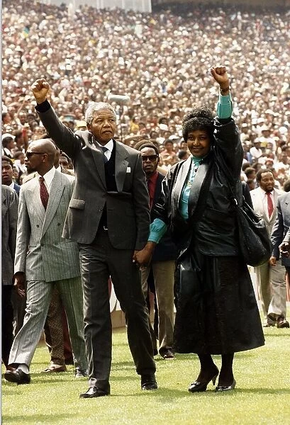 Nelson Mandela leader of ANC released from prison 1990 salutes the crowd with his
