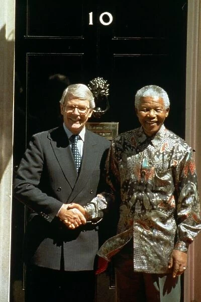 Nelson Mandela shakes hands with Prime Minister John Major at 10 Downing Street during