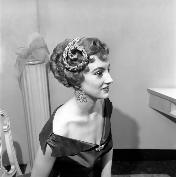 Framed Print : A new elaborate hair style created by Jose Et Francke of 171 New Bond-street for model