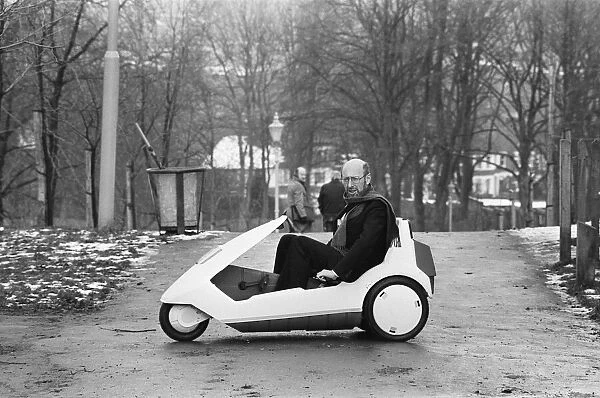 The New Electric Vehicle Sir Clive Sinclair in his new electric vehicle