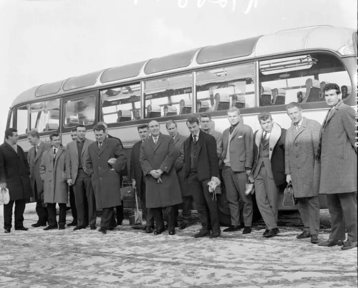 Framed Print : New England manager Alf Ramsey stands in front of the team bus with his squad of players Framed Print : New England manager Alf Ramsey stands in front of the team bus with his squad of players