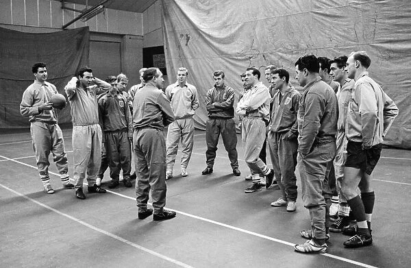 New England manager Alf Ramsey talks to his squad of players at the RAF Arena in Stanmore