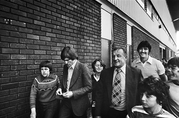 New Liverpool signing Kenny Dalglish with manager Bob Paisley at Anfield as he completes