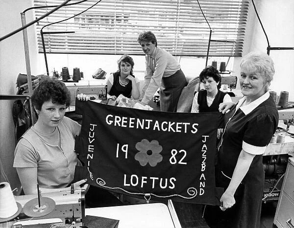 The new Loftus Greenjackets banner is held up by Julie Scaife (left) and Burton
