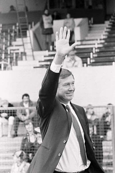 New Manchester United manager Alex Ferguson waves to supporters at the Manor Ground in