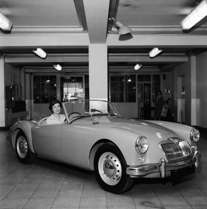 Framed Print : A new MG car on display in a showroom. 22nd September 1955