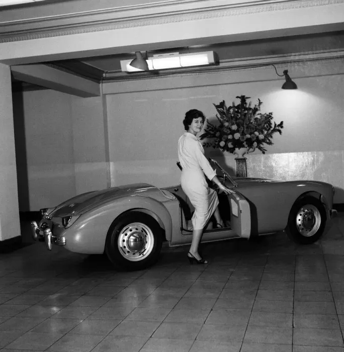 Framed Print : A new MG car on display in a showroom. 22nd September 1955 Framed Print : A new MG car on display in a showroom. 22nd September 1955