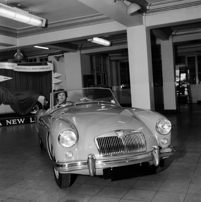 Framed Print : A new MG car on display in a showroom. 22nd September 1955 Framed Print : A new MG car on display in a showroom. 22nd September 1955