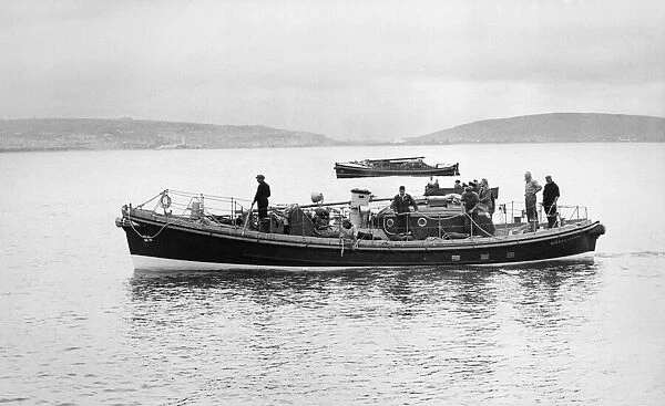 The new Mumbles lifeboat passes in front of the temporary one which replaced the SS