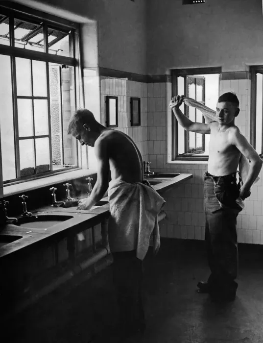 Framed Print : Two new recruits getting use to army life making an early morning toilet in one of the up Framed Print : Two new recruits getting use to army life making an early morning toilet in one of the up