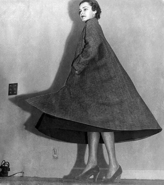 New tent style coat 10 feet round her. October 1948 P008622