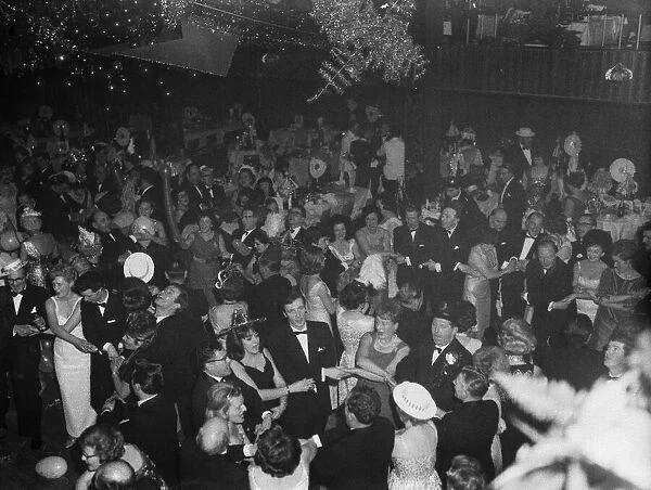 New Year Eve revellers sing Auld Lang Syne at the Leofric Hotel, Coventry. To see in 1964