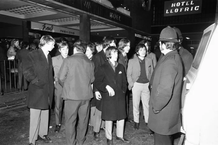 Framed Print : New Year revellers chat with the police outside the Hotel Leofric. 31st December 1971