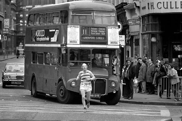 New Years Day Races in the City of London January 1975. Runner with double