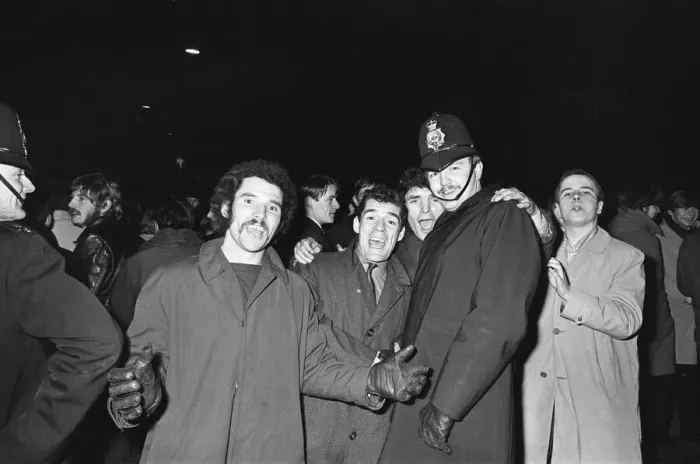 Framed Print : New Years revellers seen here celebrating with police in Ratcliffe Place Framed Print : New Years revellers seen here celebrating with police in Ratcliffe Place