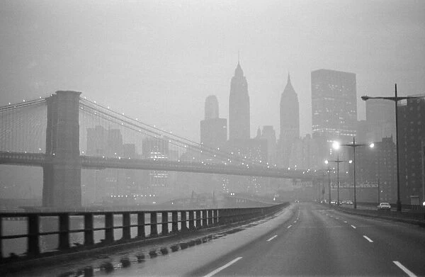 New York skyline and Brooklyn Bridge seen from the FDR Drive freeway, Manhattan, New York