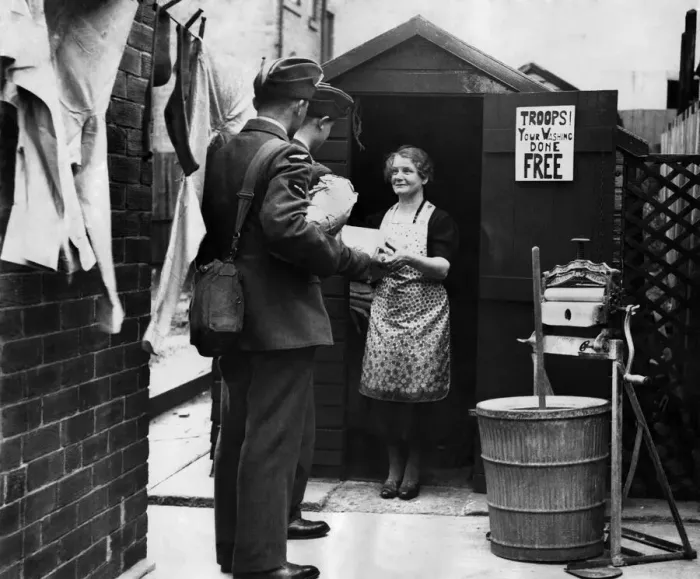 Framed Print : Newcastle housewife takes in laundry from the troops. June 1941 P012299 Framed Print : Newcastle housewife takes in laundry from the troops. June 1941 P012299