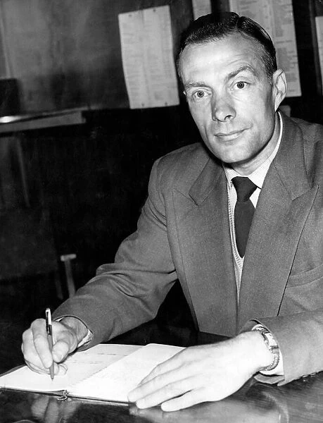 Newcastle United manager Charlie Mitten at his desk. August 1958