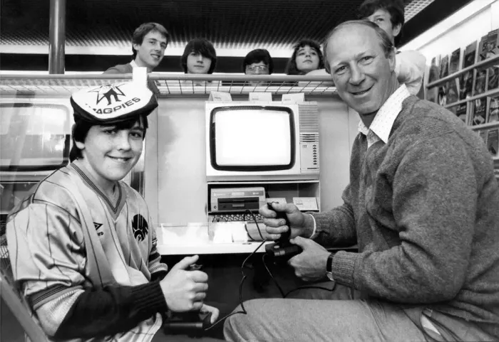 Framed Print : Newcastle United manager Jack Charlton playing on a computer game in November 1984