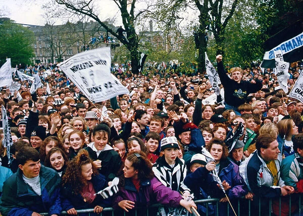 Newcastle United win the First Division. Fans lined along the route of the players