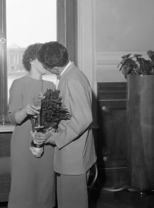 Framed Print : A newly married Russian couple kissing in the registrar office in Leningrad