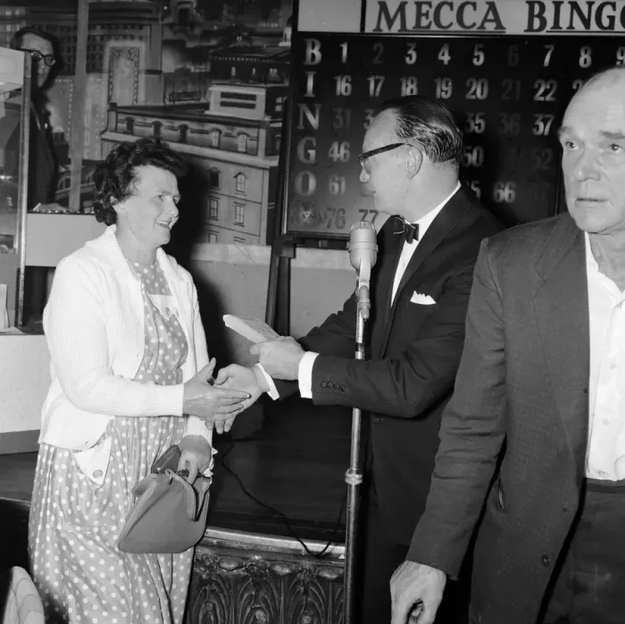 Framed Print : Newsagent Mrs Helen Retter picks up her £83 prize money after a winning night out