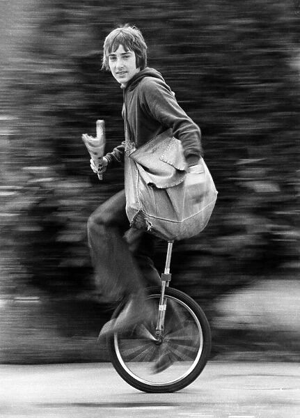 Newsboy Nigel Safe aged 14, knows what makes his paper round run smoothly- his unicycle