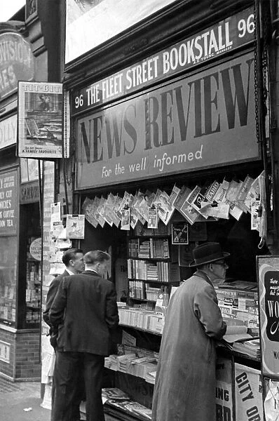 A newspaper vendor in Londons Fleet Street circa 1950